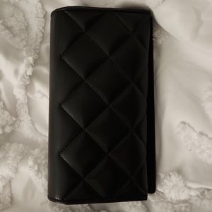 Black Chanel sunglasses empty case.